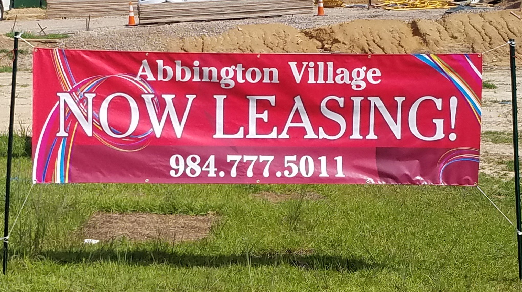 a banner advertising now leasing